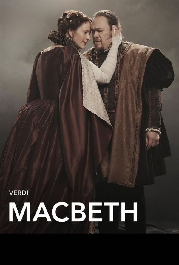 Promotional poster for Verdi's Macbeth with a woman in a burgundy gown embracing a man in ornate period robes; 'MACBETH' at the bottom.
